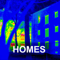 Thermogram of a well-insulated building (Passivhaus), with traditional building in background.